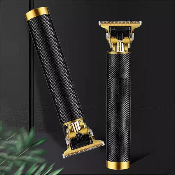 Two black and gold T9 hair trimmers on dark background in Pakistan