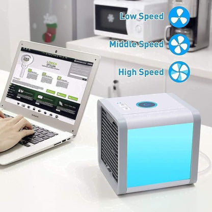 Mini AC cooling fan on desk with laptop in Pakistan
