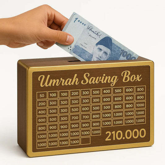 Hand placing money into Umrah saving box in Pakistan