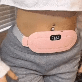 Pink menstrual heating pad belt worn on waist close-up in Pakistan