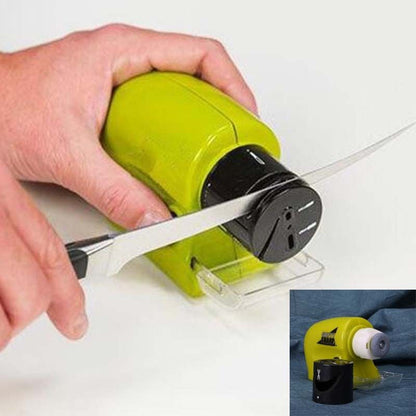 Hand using green electric knife grinder sharpener on white background in Pakistan